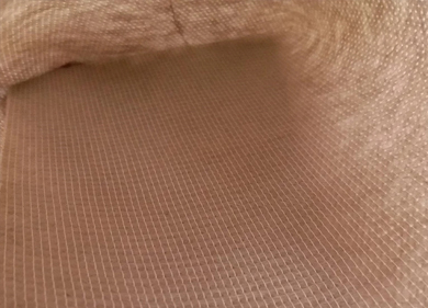 Nonwoven polyester interlining fabric for leather
